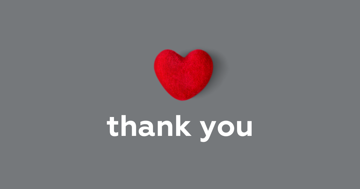 a red knitted heart is dismayed on a grey background with the words 'thank you' written below it